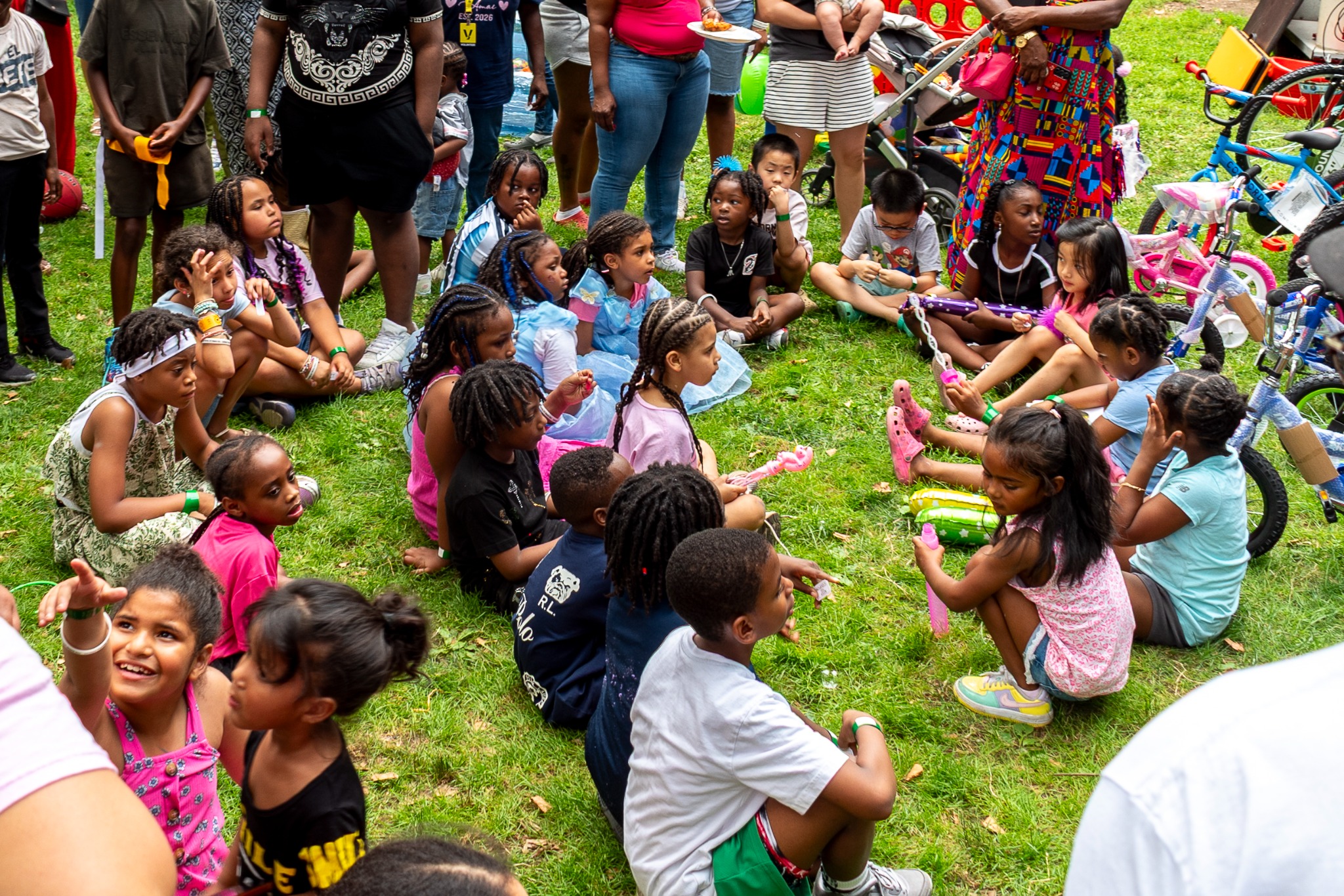 Children gathered together and participating in a United Family of Stars community activity