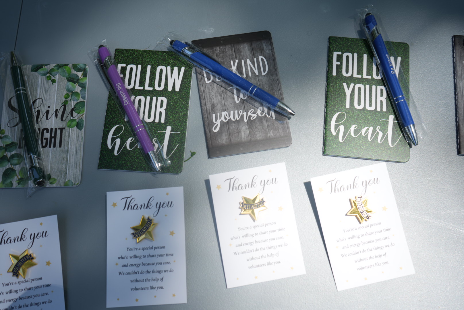 UFOS volunteer thank-you cards and volunteer star pins