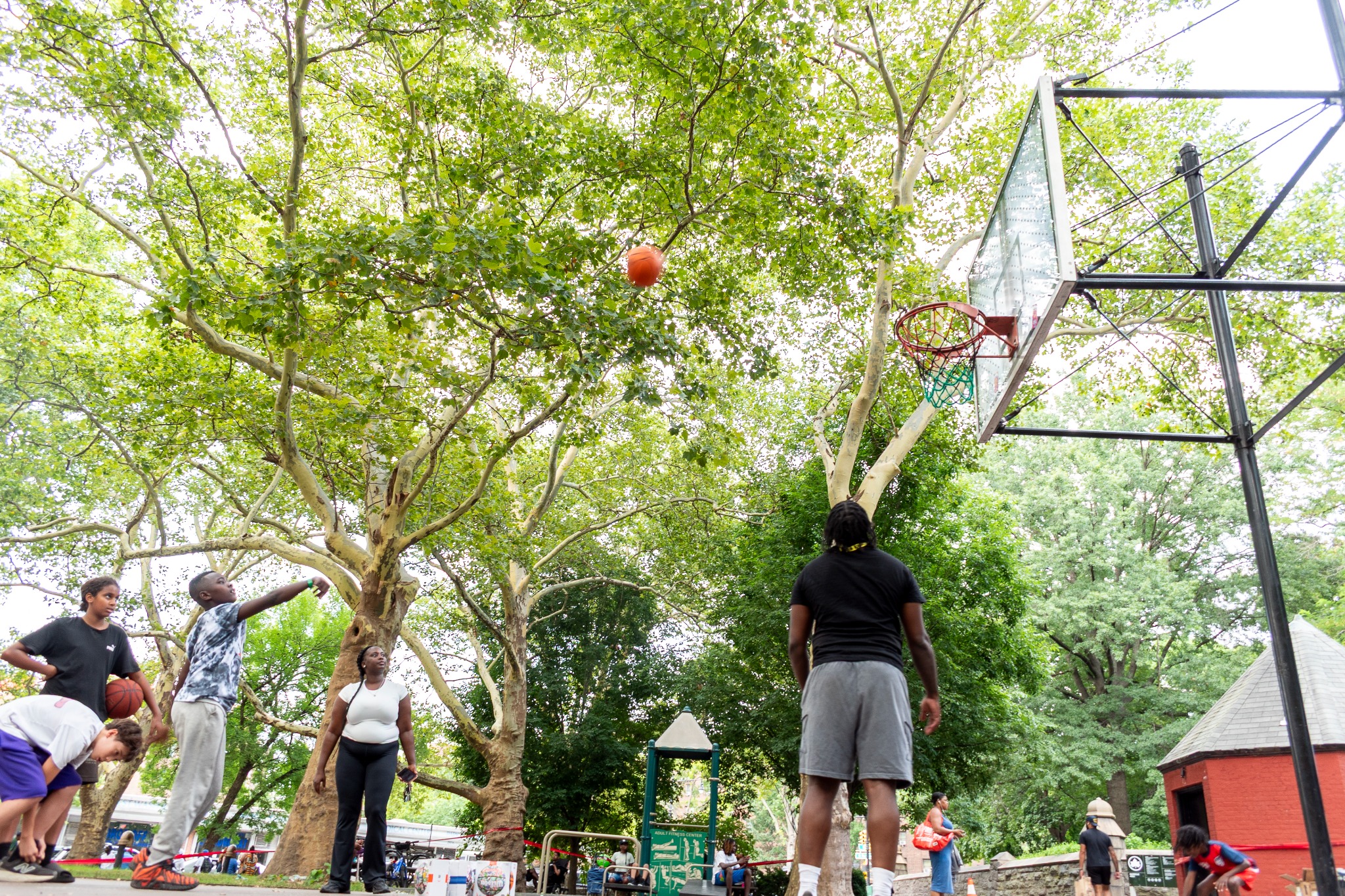 Young people playing basketball together at a United Family of Stars event