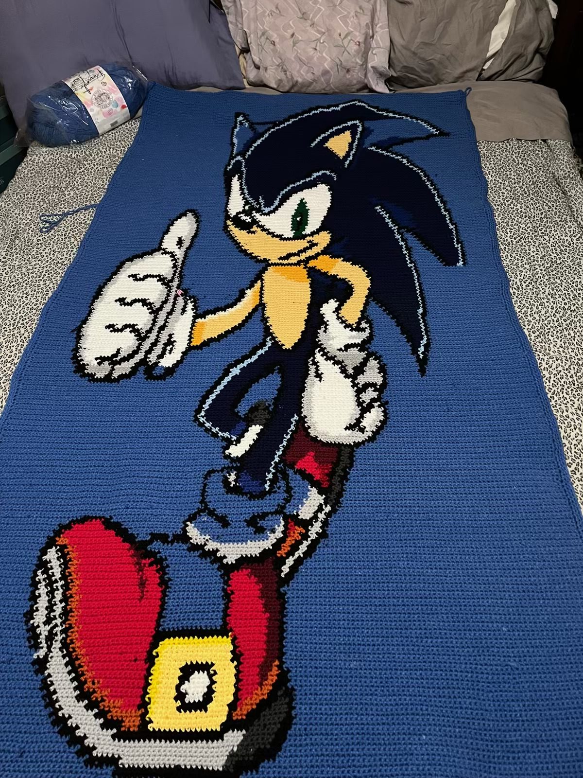 A handmade crocheted character blanket created by NiAsia