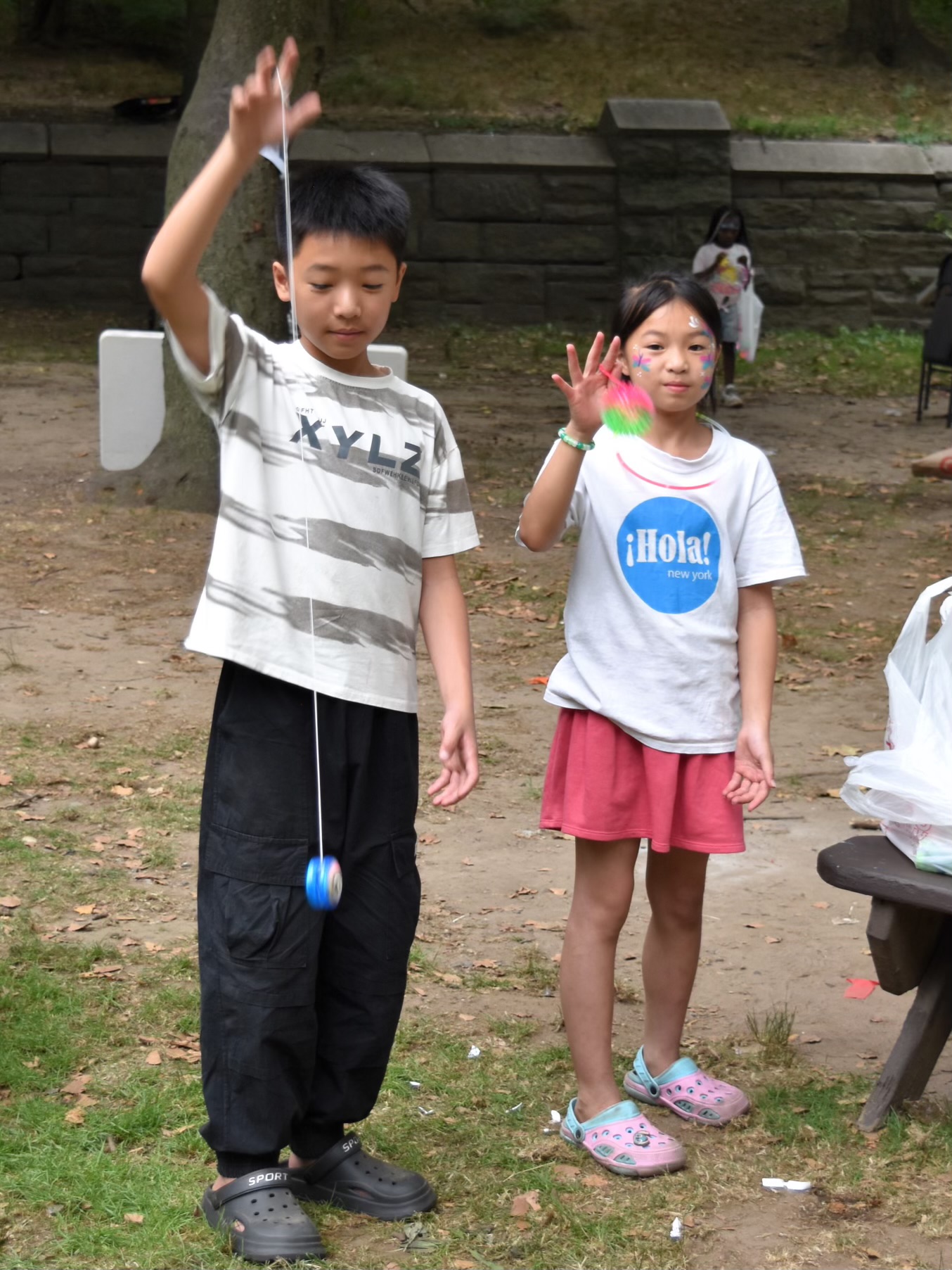 Two children playing with their giveaway toys at Children’s Day